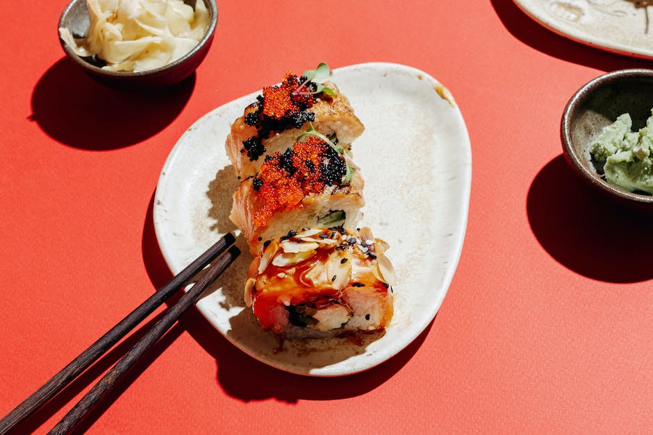 A plate of sushi with various pieces, showcasing the beauty and artistry of sushi.